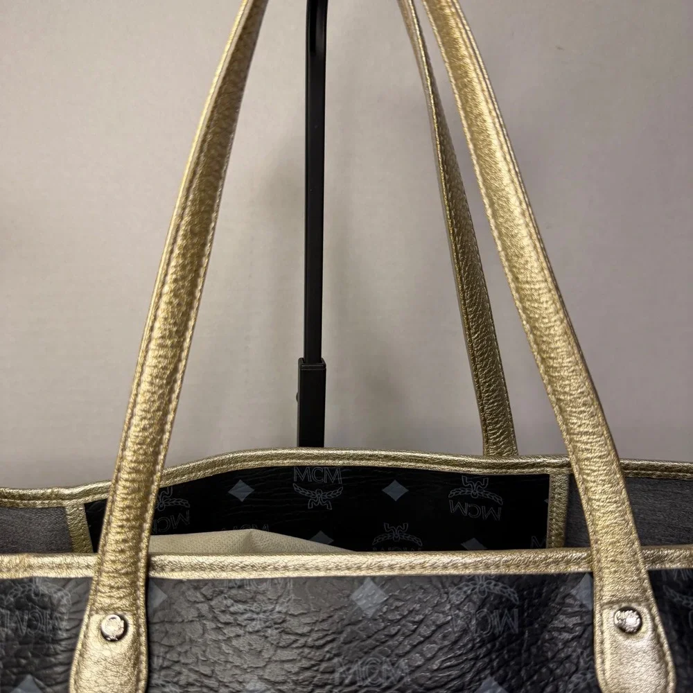 MCM Visetos Monogram Medium Tote Bag Black Gold‎ Lion Graphic Striped